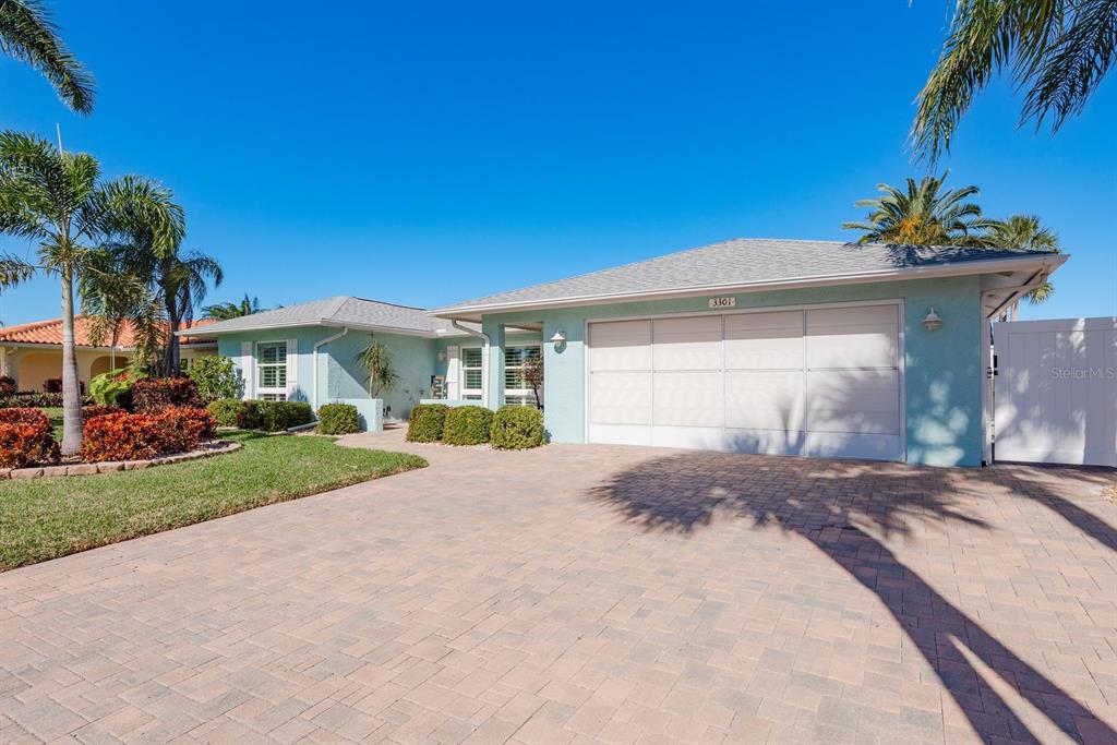 3301 Seaway Drive New Port Richey, FL 34652 - Photo 2 of 53 a front view of a house with a yard and garage