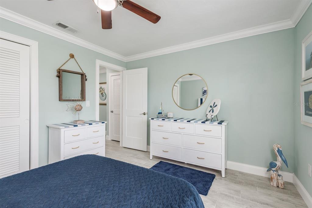 3301 Seaway Drive New Port Richey, FL 34652 - Photo 23 of 53 a bedroom with a bed and a dresser