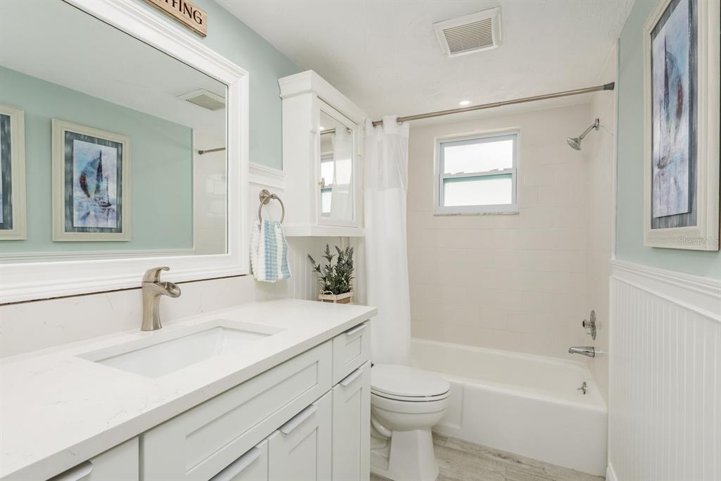 3301 Seaway Drive New Port Richey, FL 34652 - Photo 24 of 53 a bathroom with a sink a toilet and shower