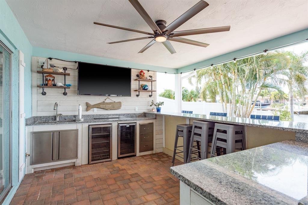3301 Seaway Drive New Port Richey, FL 34652 - Photo 29 of 53 a kitchen with stainless steel appliances granite countertop a stove and a sink
