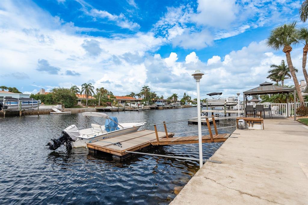 3301 Seaway Drive New Port Richey, FL 34652 - Photo 34 of 53 a view of a lake with outdoor seating