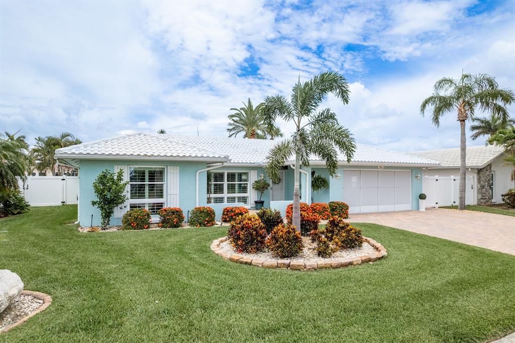 3301 Seaway Drive New Port Richey, FL 34652 - Photo 39 of 53 a front view of a house with garden and porch