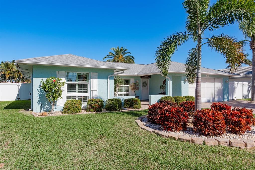 3301 Seaway Drive New Port Richey, FL 34652 - Photo 4 of 53 front view of a house with a yard
