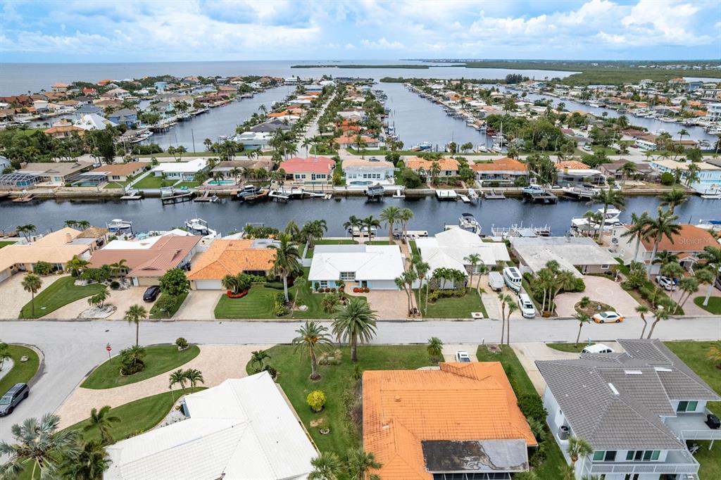 3301 Seaway Drive New Port Richey, FL 34652 - Photo 43 of 53 an aerial view of residential houses with outdoor space and lake view