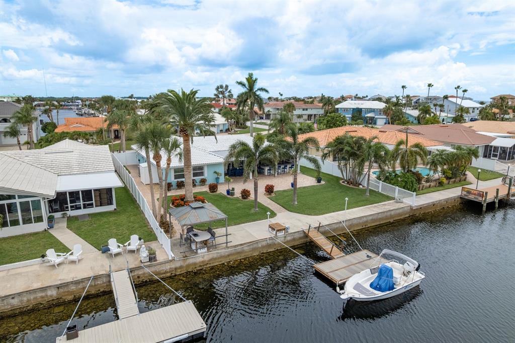 3301 Seaway Drive New Port Richey, FL 34652 - Photo 50 of 53 an aerial view of a house with swimming pool and lake view