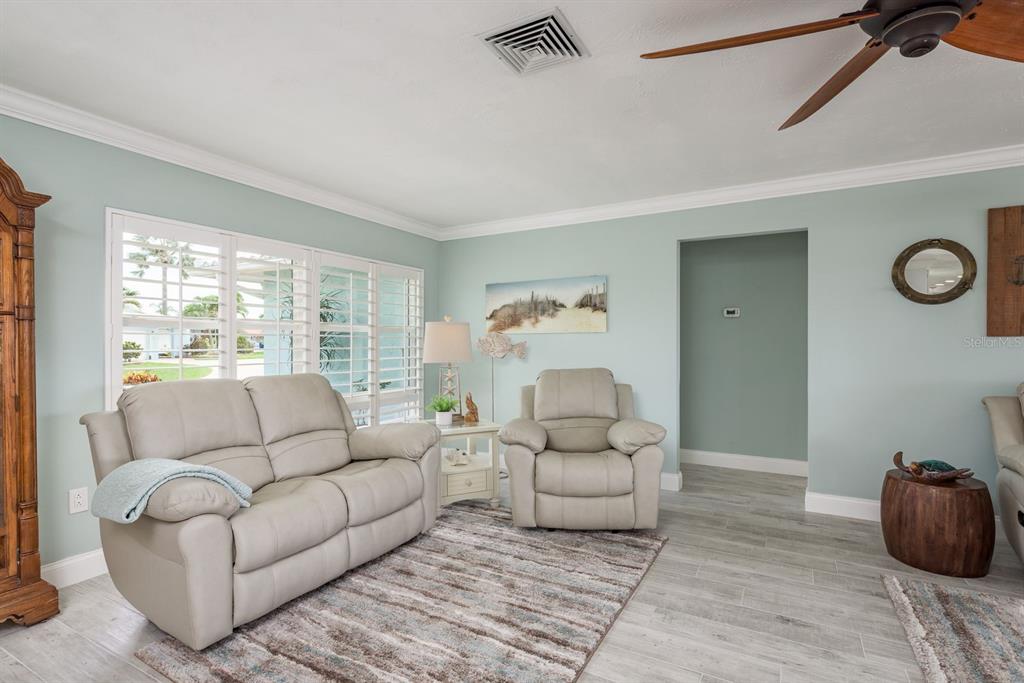 3301 Seaway Drive New Port Richey, FL 34652 - Photo 8 of 53 a living room with furniture and a large window