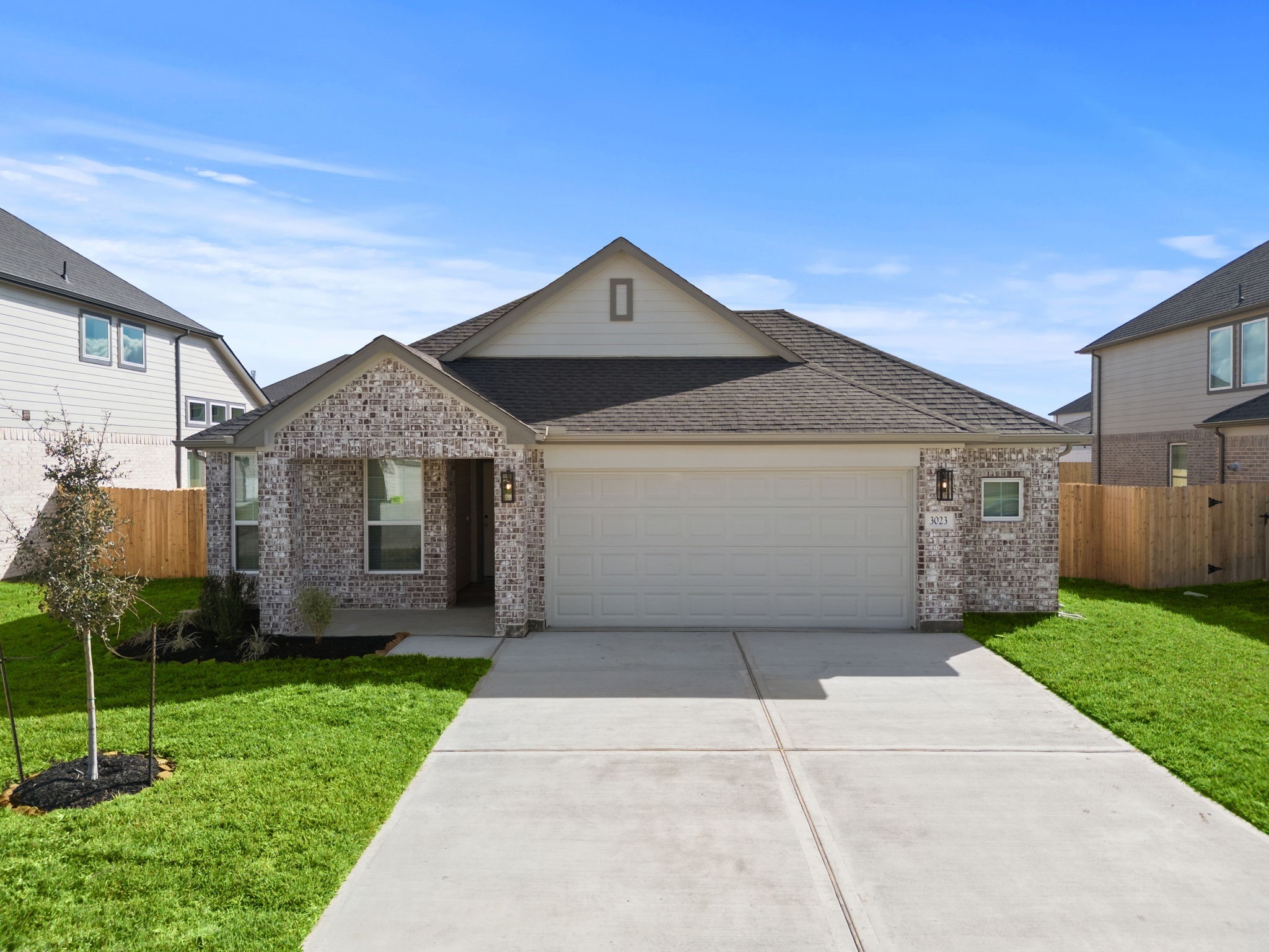 3023 Boulder Rdg Drive Rosenberg, TX 77471 - Photo 23 of 34 a front view of a house with a yard and garage