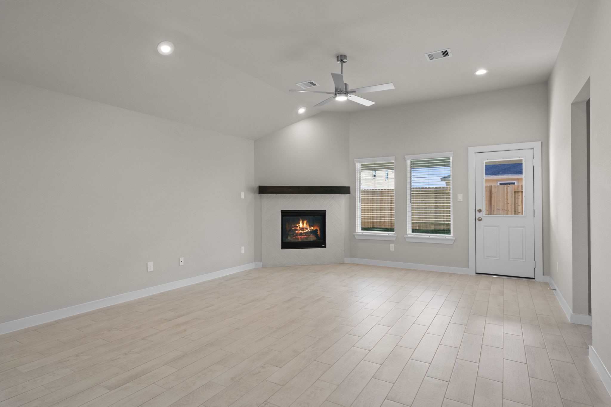 3023 Boulder Rdg Drive Rosenberg, TX 77471 - Photo 8 of 34 a view of an empty room with window and wooden floor