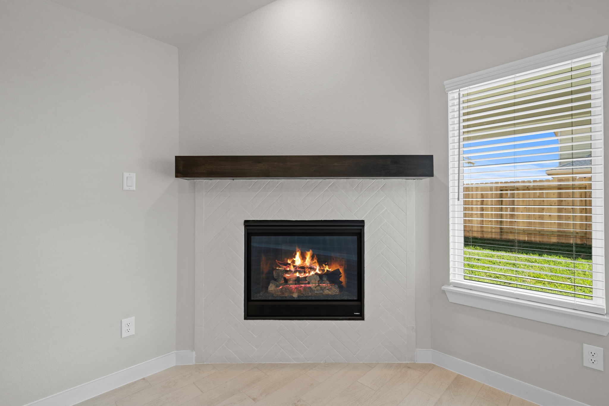 3023 Boulder Rdg Drive Rosenberg, TX 77471 - Photo 10 of 34 a living room with a fireplace and a window