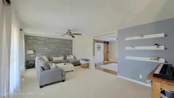 a kitchen with kitchen island granite countertop a sink appliances cabinets and a counter top space