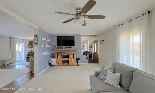 a large kitchen with stainless steel appliances granite countertop a stove refrigerator and a sink