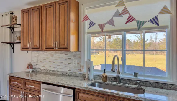 a kitchen with a refrigerator and a sink
