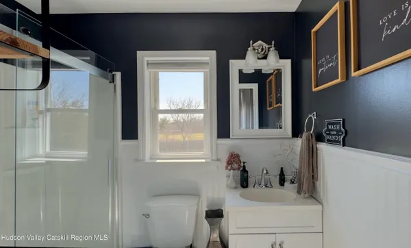 a bedroom with furniture and a closet