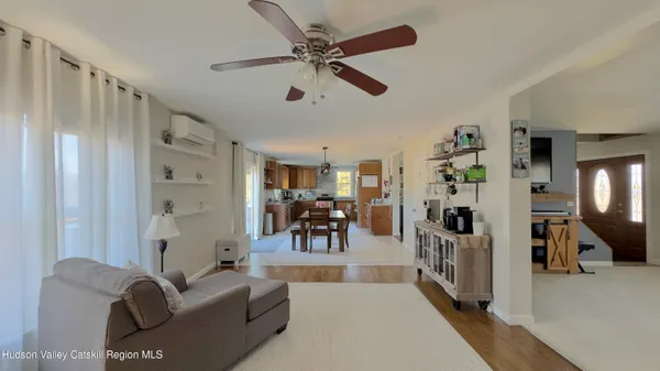 a bedroom with furniture and a wooden floor