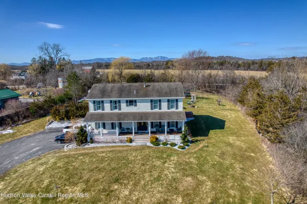 a front view of a building and car parked