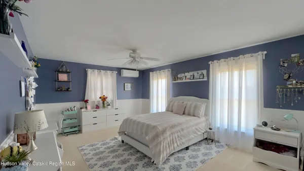 a view of a room with toys and wooden floor