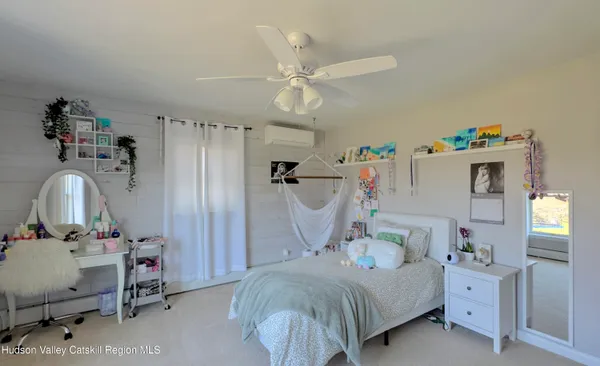 a bedroom with a bed and a table