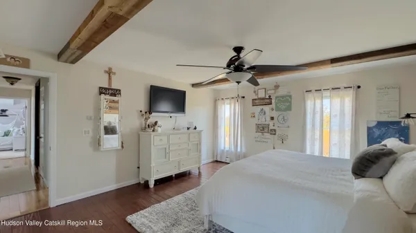 an aerial view of a house with outdoor space and lake view