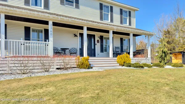 a view of a house with pool table and chairs