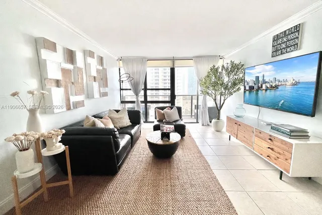 a living room with furniture and a large window