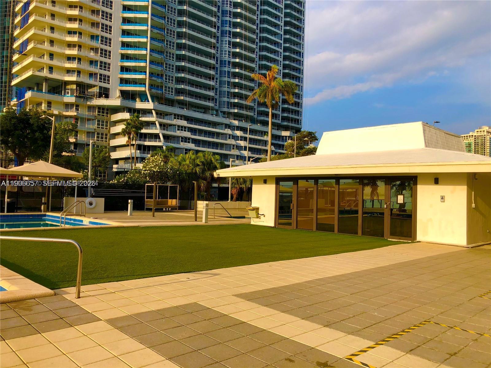 600 Northeast 36th Street, Unit 2011 Miami, FL 33137 - Photo 28 of 49 a view of a building with a garden