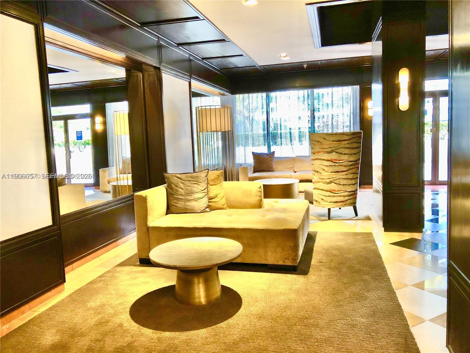 600 Northeast 36th Street, Unit 2011 Miami, FL 33137 - Photo 31 of 49 a living room with furniture and a large window