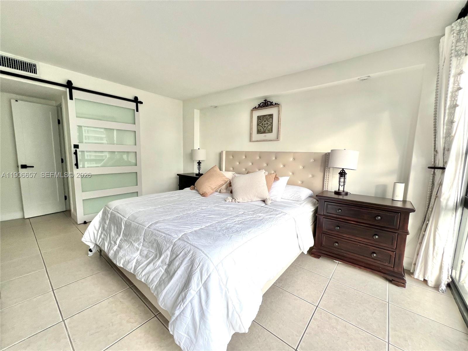 600 Northeast 36th Street, Unit 2011 Miami, FL 33137 - Photo 7 of 49 a bedroom with a bed and a closet