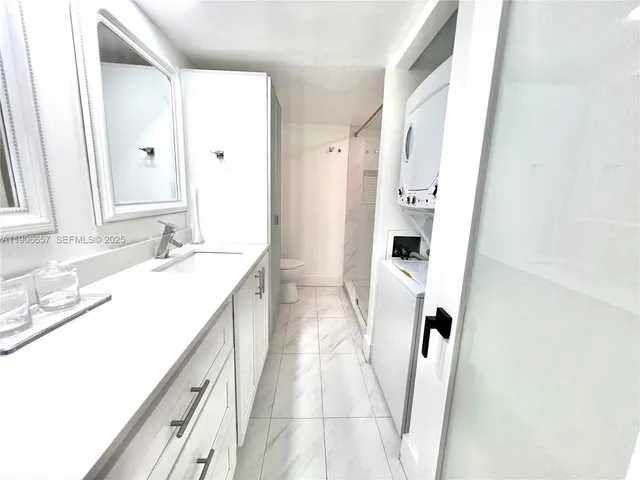 a bathroom with a sink a mirror and a shower