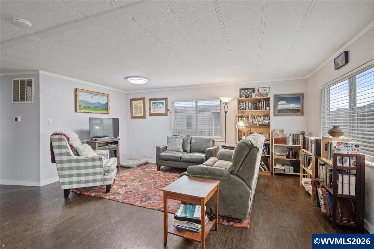 5422 Portland Road Northeast, Unit 123 Salem, OR 97305 - Photo 9 of 23 a living room with furniture and wooden floor