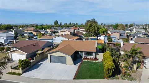 a view of water heater room with wooden floor