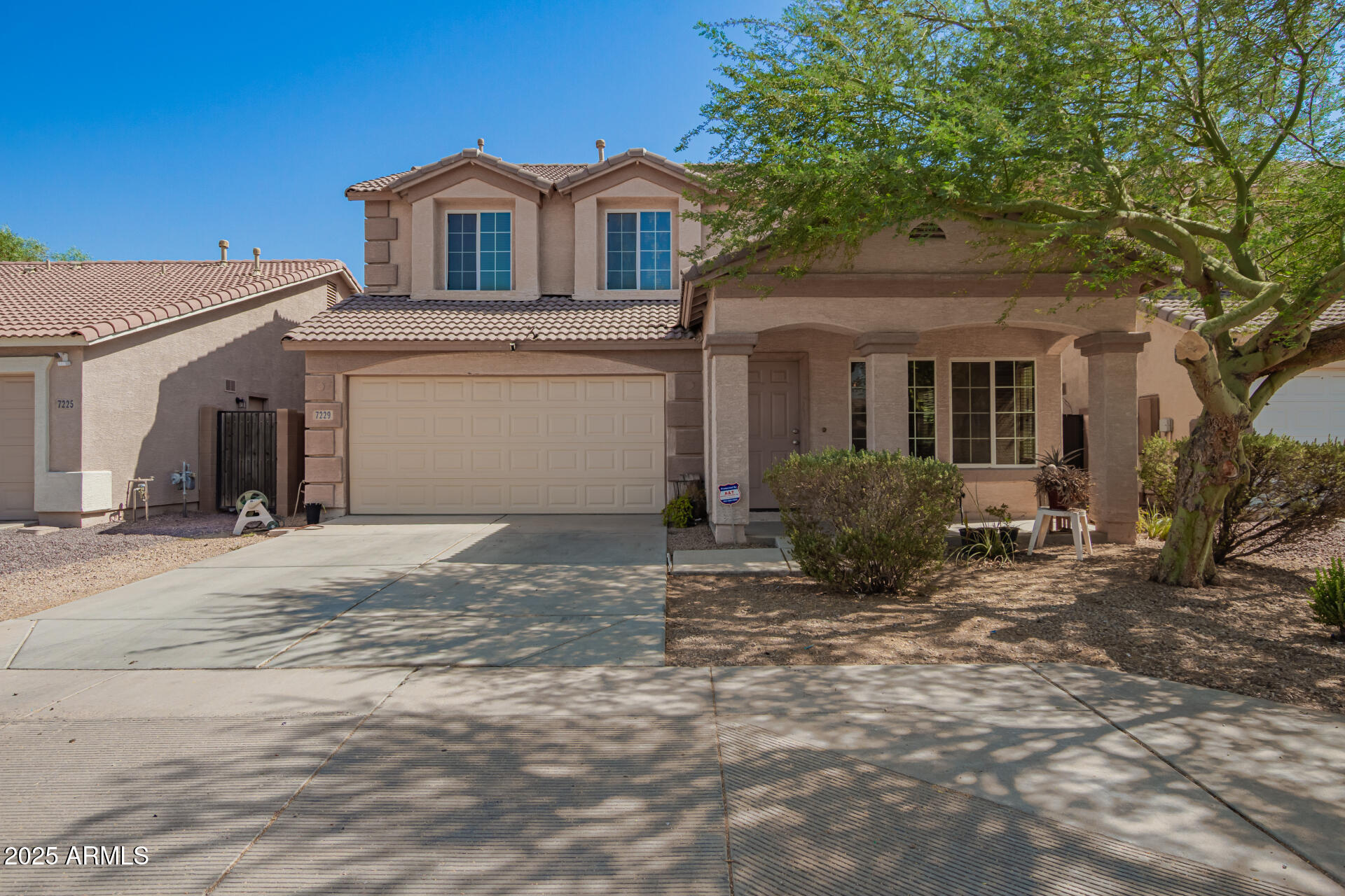 7229 West Crown King Road Phoenix, AZ 85043 - Photo 1 of 38 a front view of a house with a yard