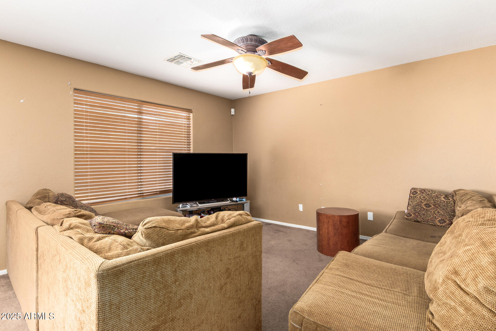 7229 West Crown King Road Phoenix, AZ 85043 - Photo 11 of 38 a living room with furniture and a flat screen tv