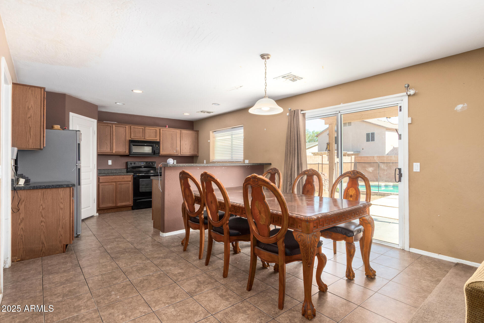 7229 West Crown King Road Phoenix, AZ 85043 - Photo 13 of 38 a view of a dining room with furniture and chandelier