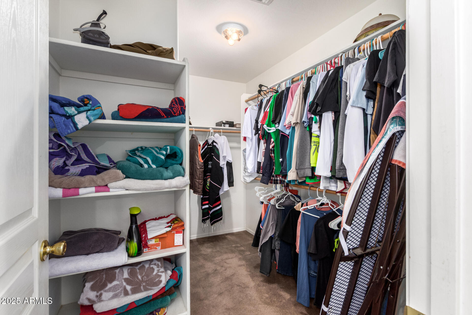 7229 West Crown King Road Phoenix, AZ 85043 - Photo 24 of 38 a view of walk in closet with clothes and shoes