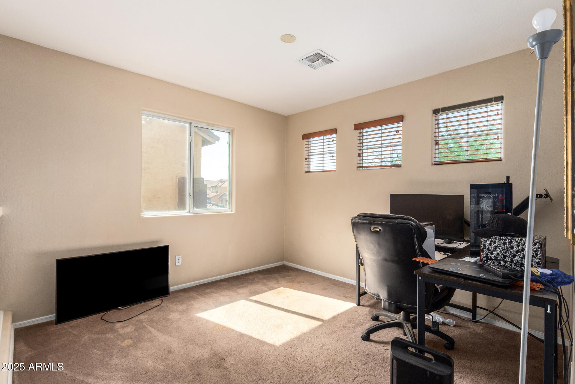 7229 West Crown King Road Phoenix, AZ 85043 - Photo 31 of 38 a view of a workspace with furniture and a window