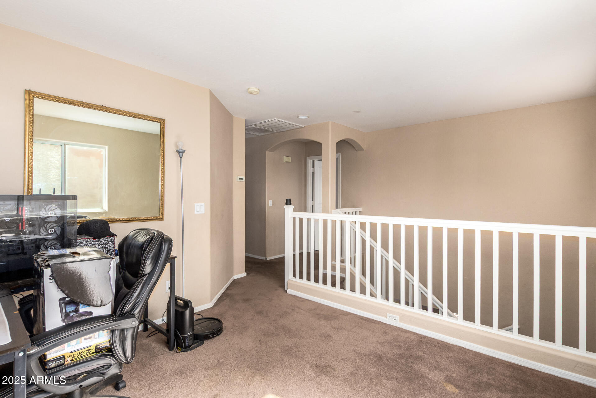 7229 West Crown King Road Phoenix, AZ 85043 - Photo 32 of 38 a view of a workspace with furniture and a window