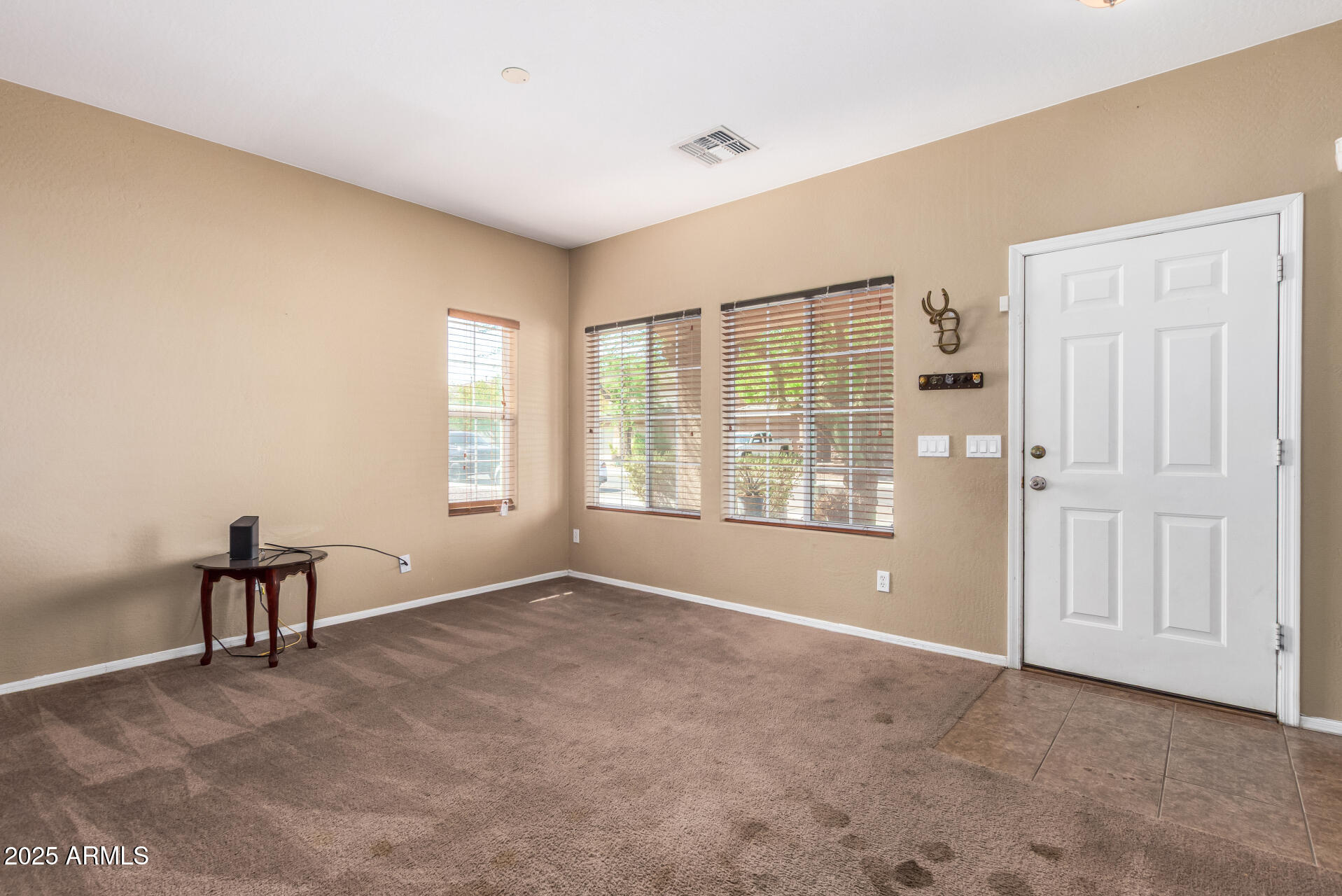 7229 West Crown King Road Phoenix, AZ 85043 - Photo 7 of 38 a view of an empty room with a window