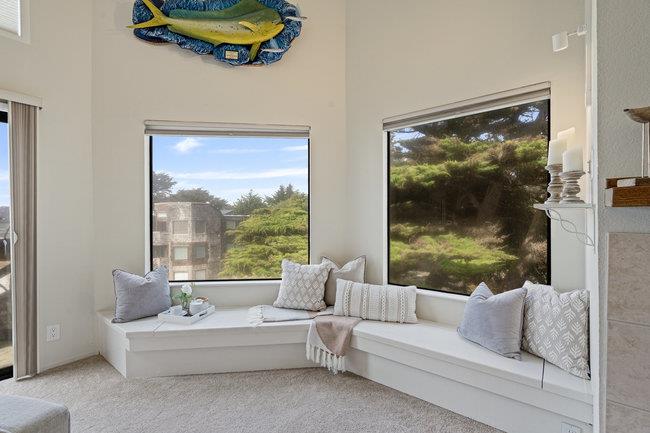 101 Shell Road, Unit 102 Watsonville, CA 95076 - Photo 14 of 34 a living room with furniture and a large window