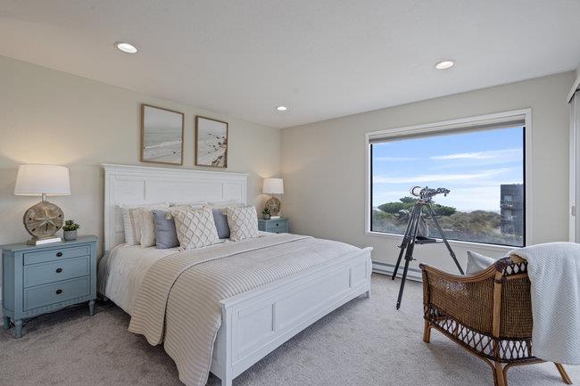 101 Shell Road, Unit 102 Watsonville, CA 95076 - Photo 2 of 34 a bedroom with a bed and a couch