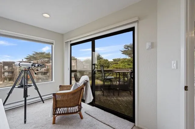 a view of two chairs in the room