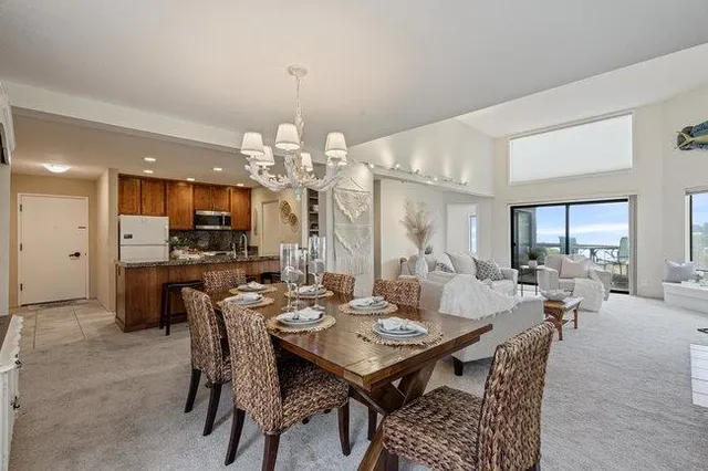 a view of a dining room and livingroom view kitchen and dining table