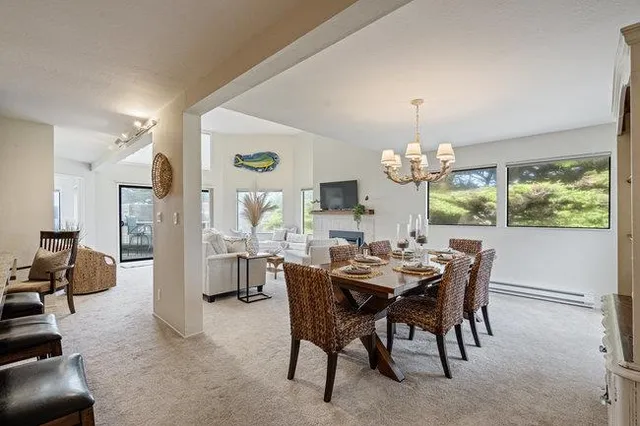 a view of a dining room with furniture window and outside view
