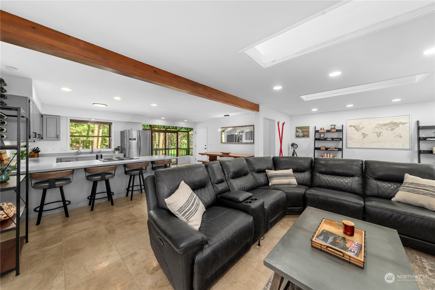 9151 Icicle Road, Unit E Leavenworth, WA 98826 - Photo 12 of 40 a living room with furniture and a dining table with kitchen view