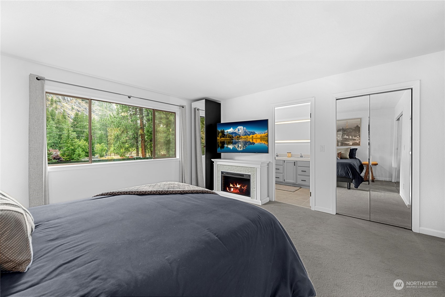 9151 Icicle Road, Unit E Leavenworth, WA 98826 - Photo 14 of 40 a view of a livingroom with a fireplace and a window