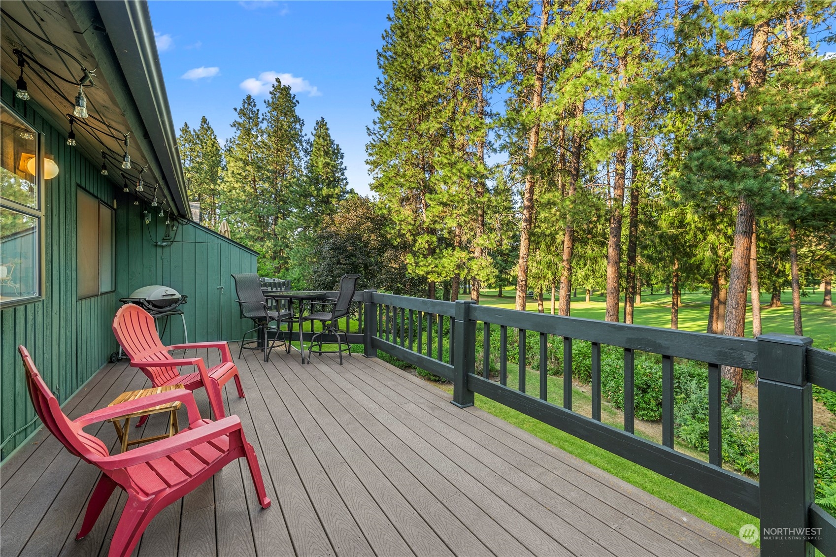 9151 Icicle Road, Unit E Leavenworth, WA 98826 - Photo 26 of 40 a balcony with wooden floor table and chairs