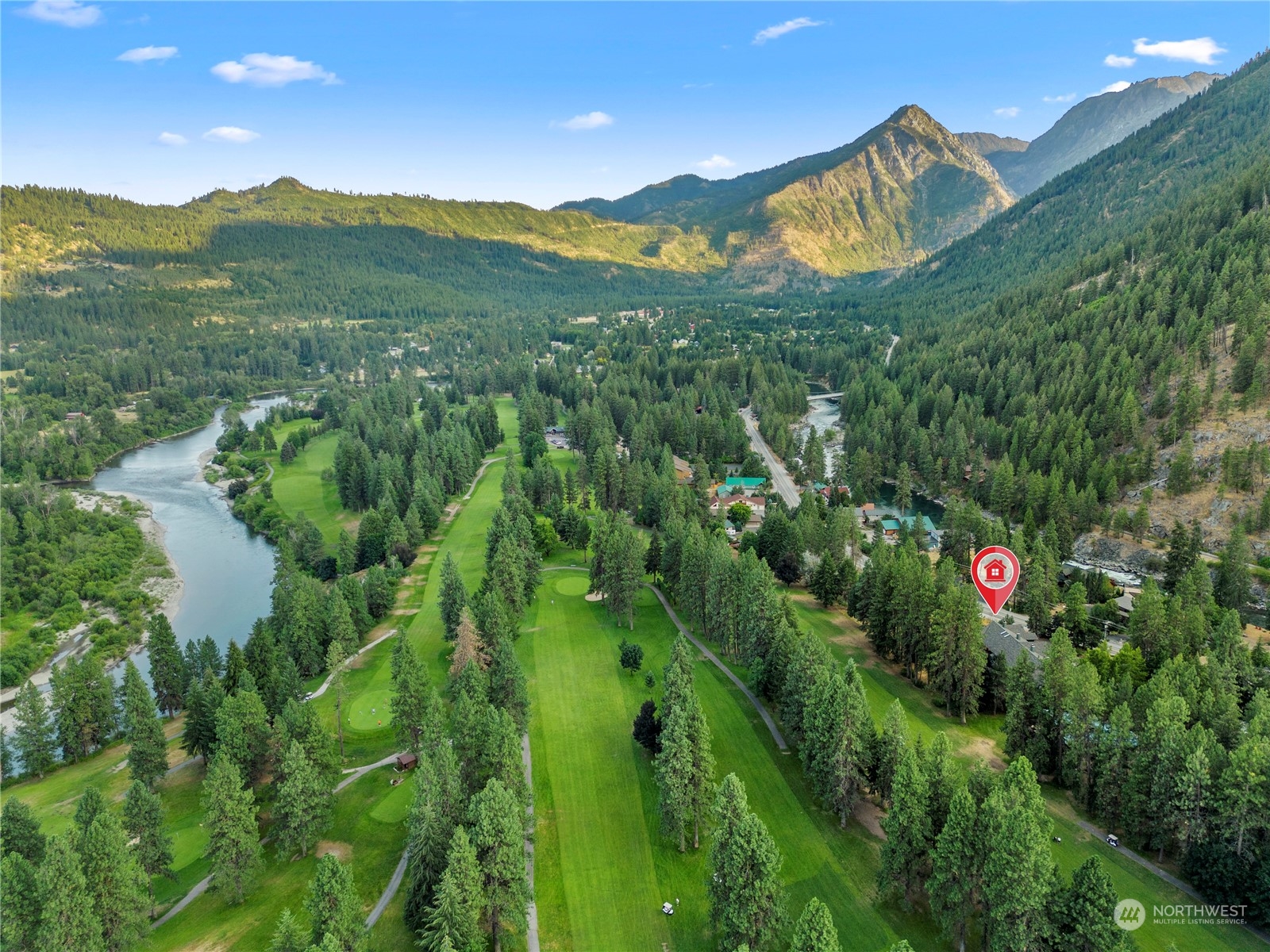9151 Icicle Road, Unit E Leavenworth, WA 98826 - Photo 28 of 40 a view of a house with a lush green forest