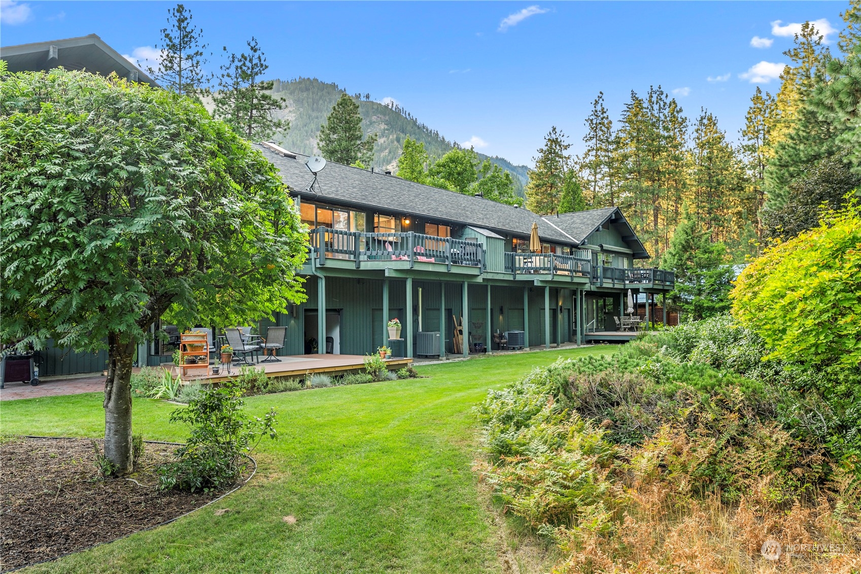 9151 Icicle Road, Unit E Leavenworth, WA 98826 - Photo 31 of 40 a front view of a house with a yard