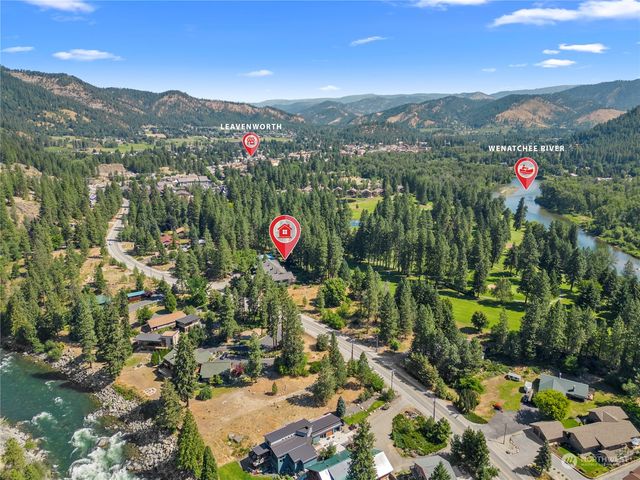 a view of a garden with mountains in the background