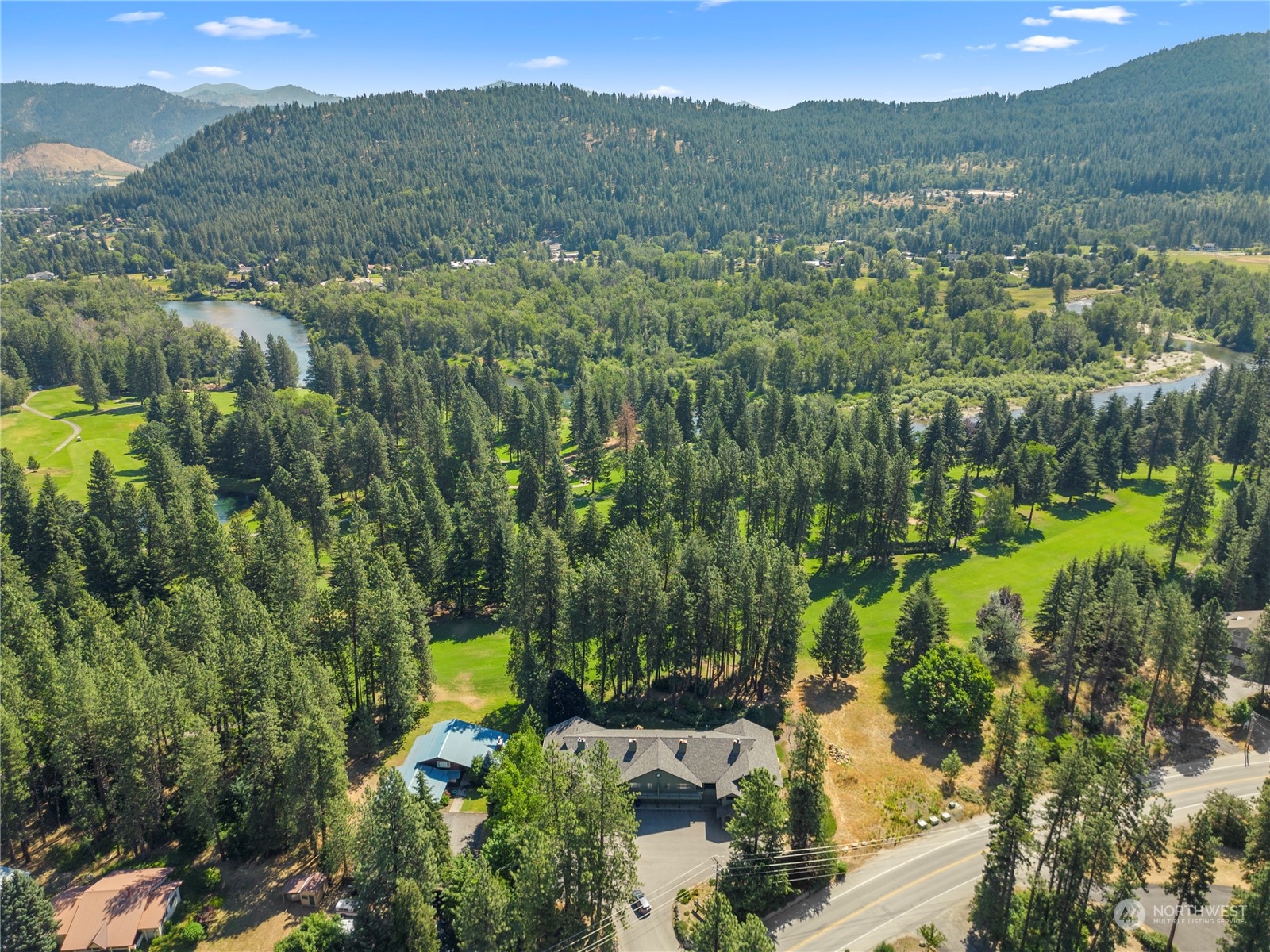9151 Icicle Road, Unit E Leavenworth, WA 98826 - Photo 36 of 40 a view of a garden with mountains in the background