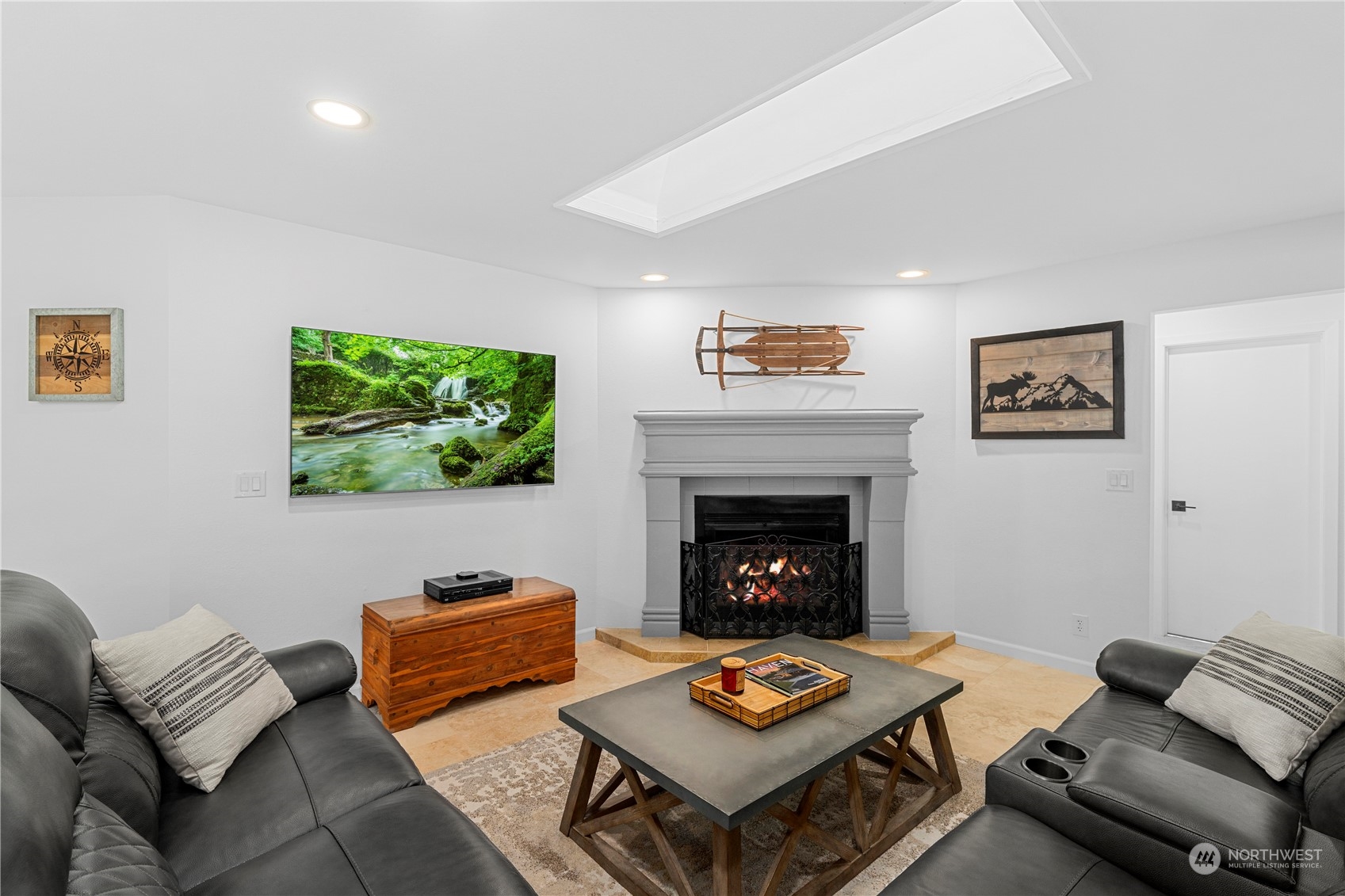9151 Icicle Road, Unit E Leavenworth, WA 98826 - Photo 10 of 40 a living room with furniture and a fireplace